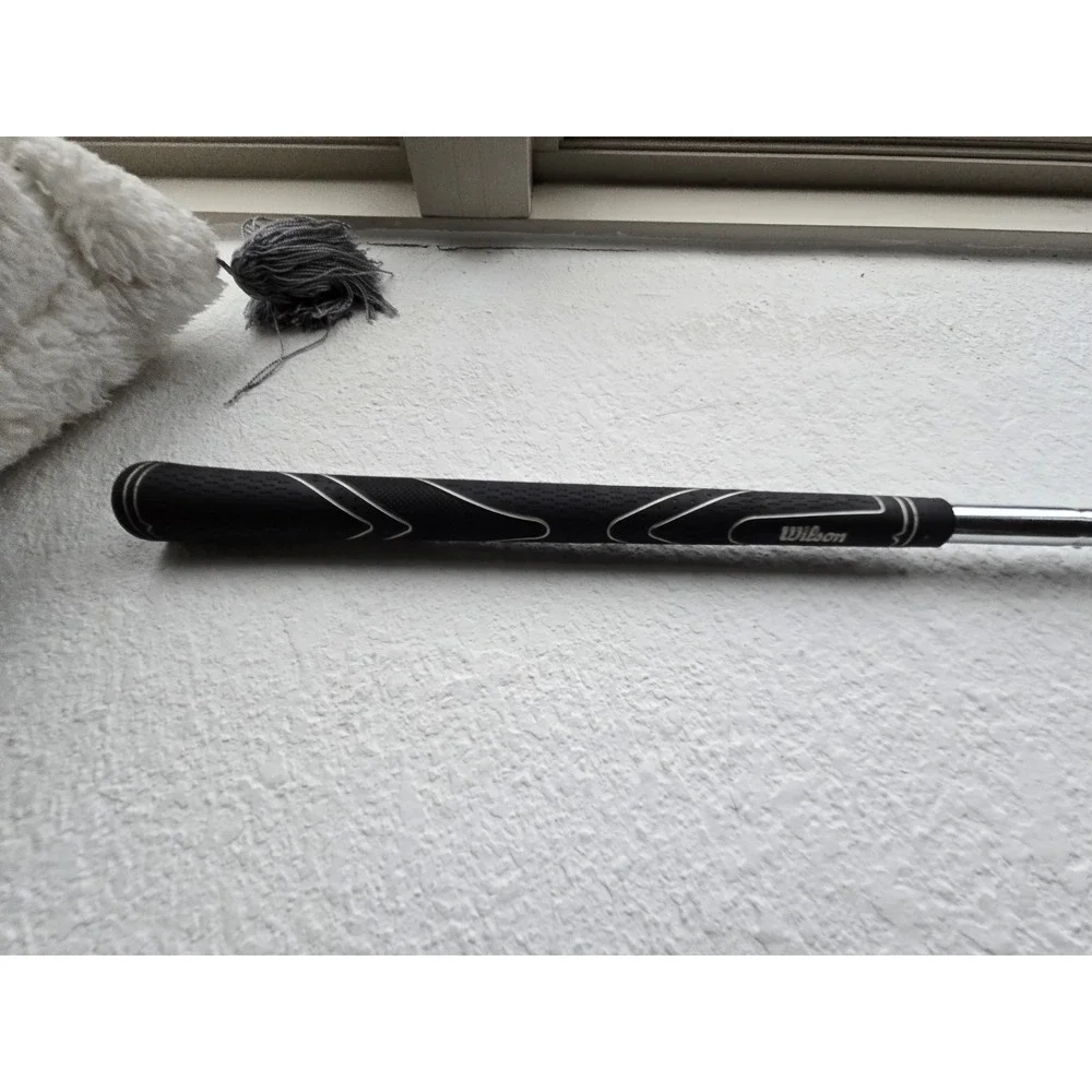 Wilson Ultra BLK iron, recognizable by the orange cavity.pitching Wedge 35.25